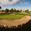 A view of a green with water and bunkers coming into play at Western Skies Golf Club.